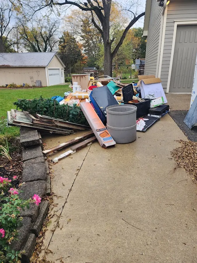 Dumpster being loaded with debris for Commercial Dumpster Rental in Citronelle
